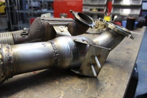 Tack-welding the bracket of the Fiesta ST downpipe